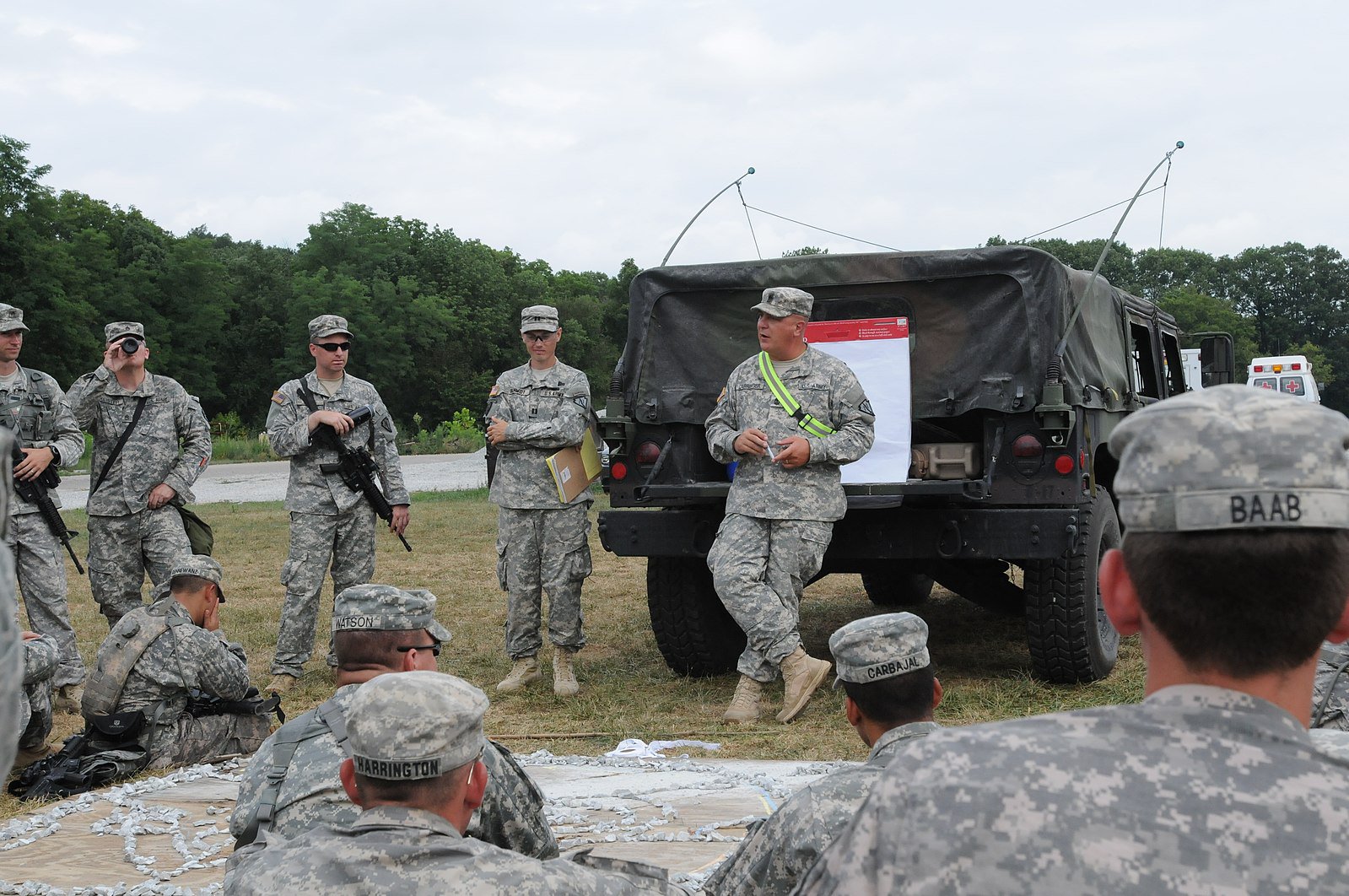 U.S._Army_1st_Sgt._Robert_Darringer,_center_right,_with_the_2nd_Battalion,_151st_Infantry_Regiment,_conducts_an_after_action_review_with_his_Soldiers_after_training_at_the_Muscatatuck_Urban_Training_Center_120805-A-WW110-003.jpg