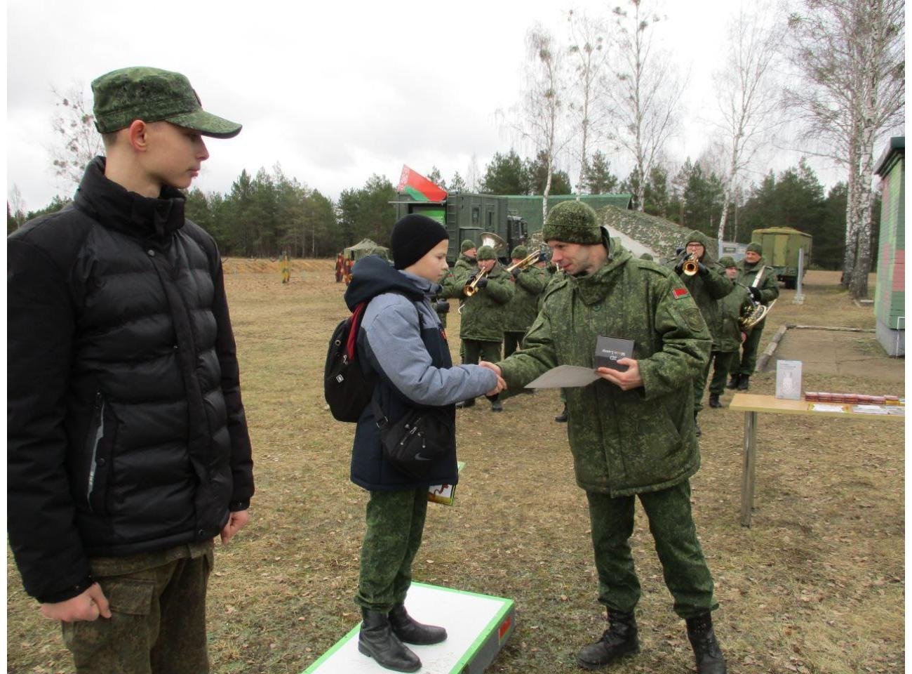 Children from the military-patriotic club "Grenada" receive awards at the training ground