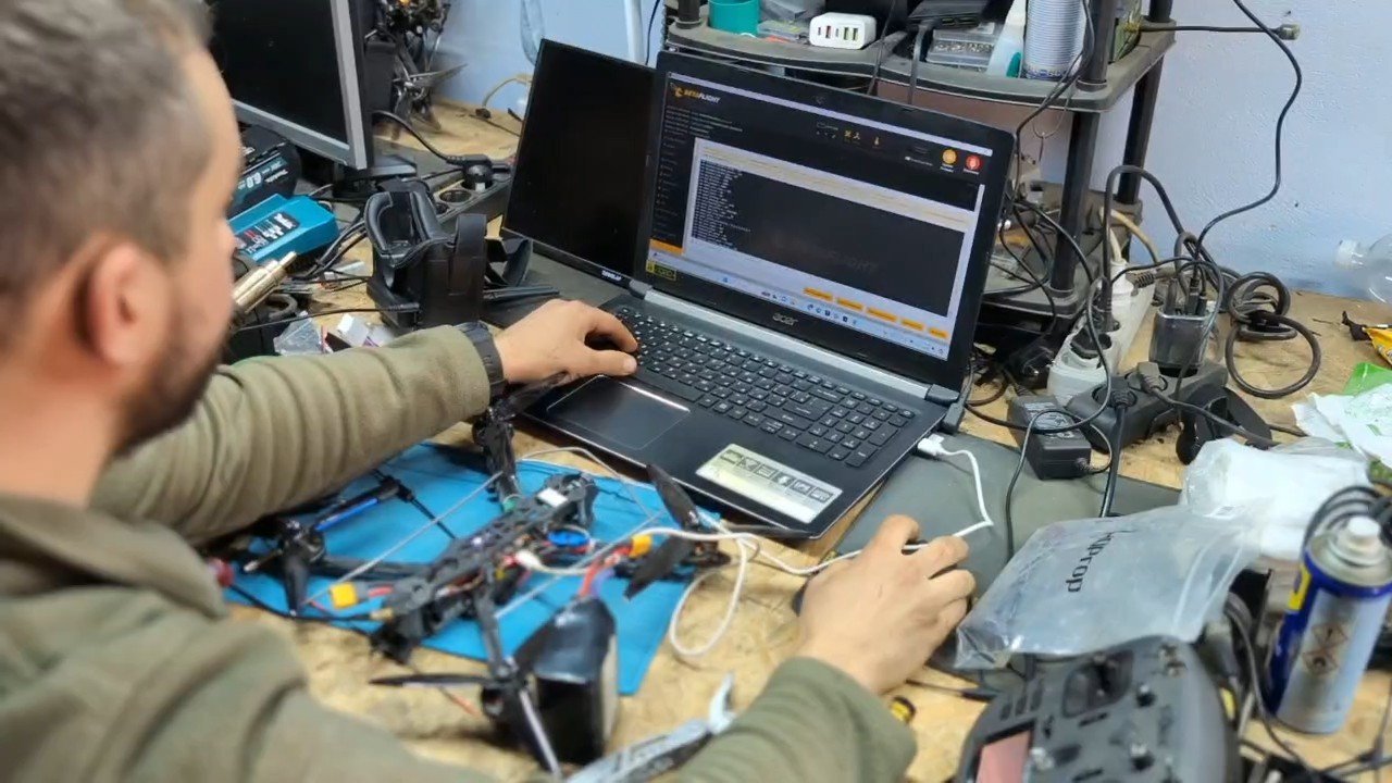 An FPV drone repair engineer is at work.